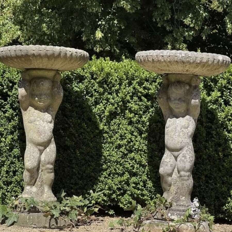 A Pair of Vintage Composite Stone Cherub Bird Baths